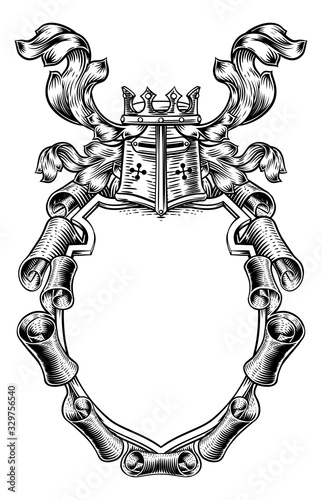 A royal coat of arms scroll shield crest with a knights helmet and crown