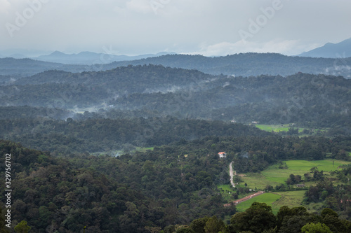 Misty mountains range with amazing sky photo