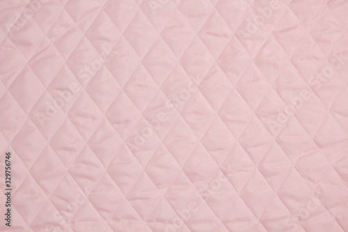 Fabric velour quilted close-up. Quilted surface upholstery