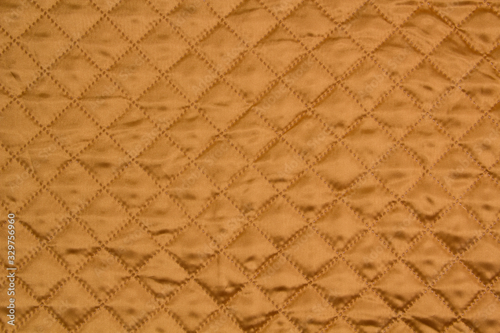 Fototapeta premium Fabric velour quilted close-up. Quilted surface upholstery