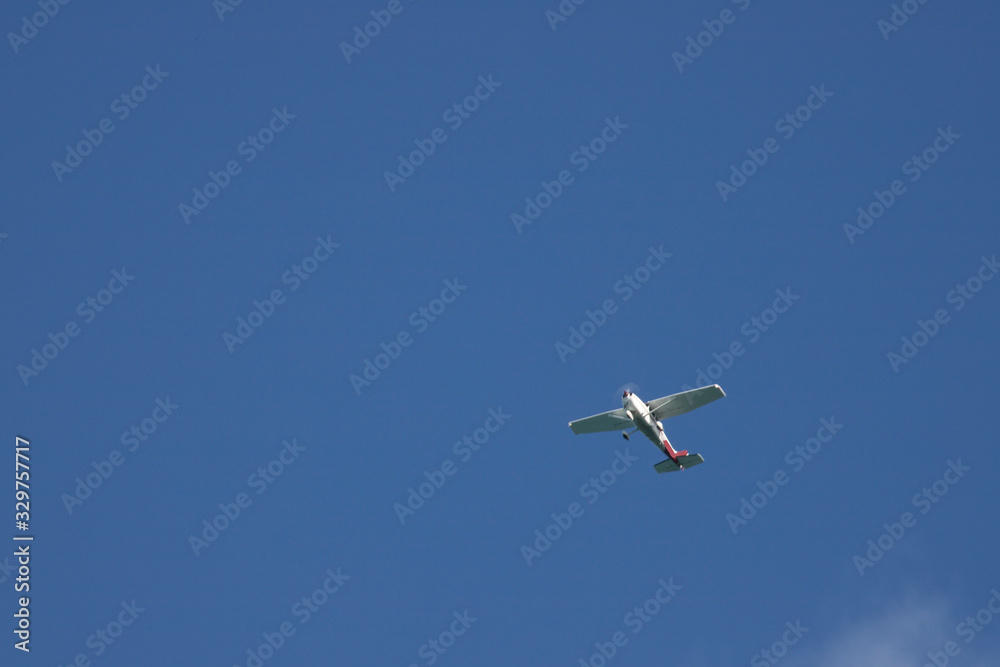 Clear sunny day. Silence and peace. Blue clear sky. The plane rises up. Clear sunny day. Silence and peace. Blue clear sky. The plane rises up.