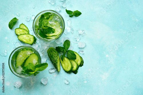 Summer refreshing drink with cucumber and mint. Top view with copy space.