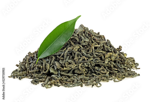 Pile of dry green tea with green tea leaf isolated on a white background