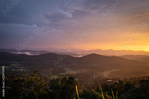 Misty mountains range with amazing sky photo