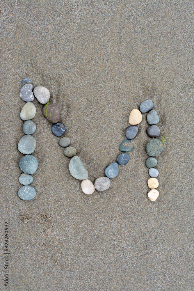 alphabet by stone on the beach alphabet by stone on the beach