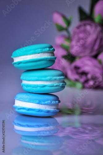 stack of blue macaroons on white background with copy space for text