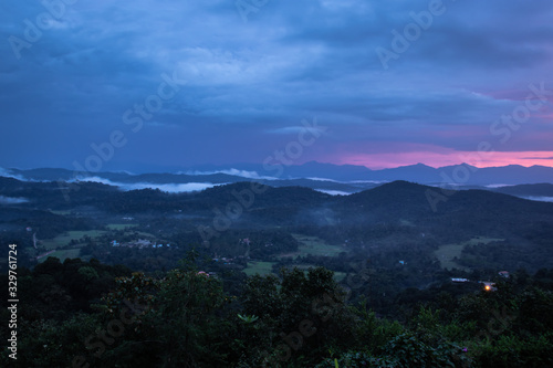 Misty mountains range with amazing sky © explorewithinfo