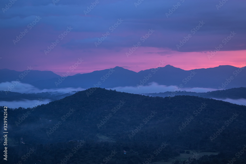 Fototapeta premium Misty mountains range with amazing sky