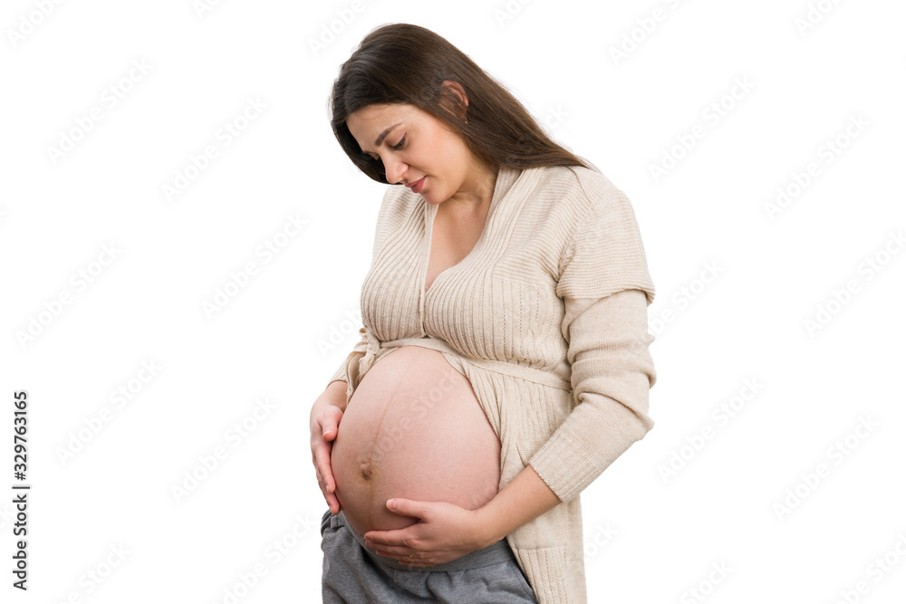 Peaceful pregnant woman checking belly