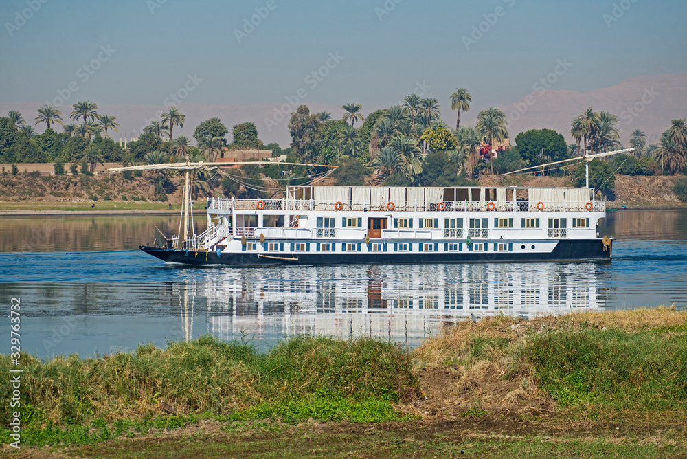 Fototapeta premium Large egyptian river cruise dahabeya boat sailing on Nile