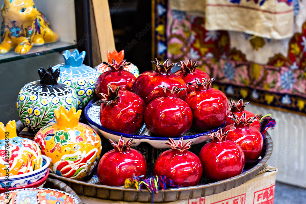 Souvenir red ceramic pomegranates for sale at Jerusalem's Old Town market.