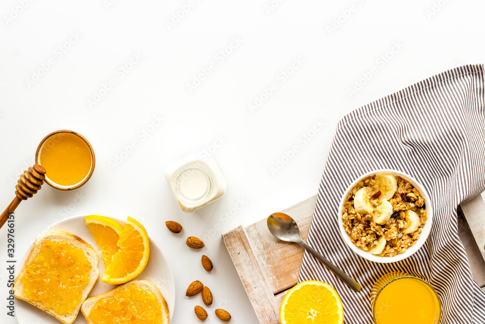 Vegetarian breakfast with granola and fruits on white background top-down frame copy space Vegetarian breakfast with granola and fruits on white background top-down frame copy space