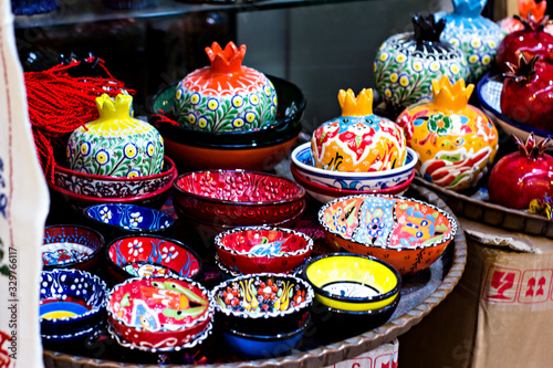 Souvenir red ceramic pomegranates for sale at Jerusalem's Old Town market.