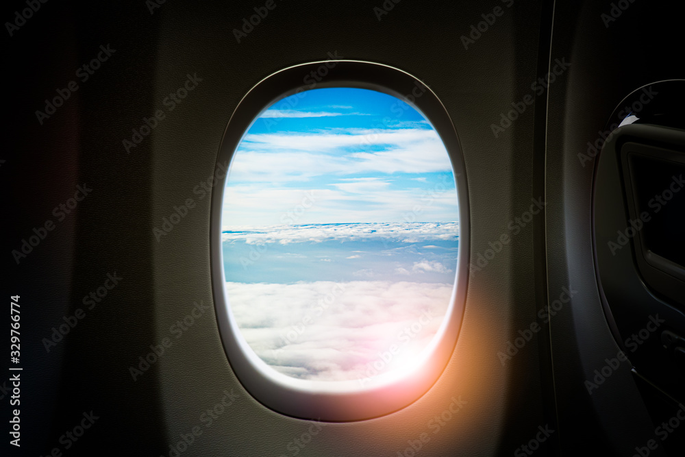Black background with copy space look of window seat frame of airplane flight see view of clouds sky, wing travel during coronavirus risk crisis fall demand of flight cancel Black background with copy space look of window seat frame of airplane flight see view of clouds sky, wing travel during coronavirus risk crisis fall demand of flight cancel