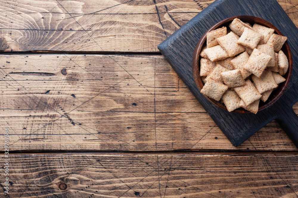 Cookies with chocolate filling, flakes from natural cereals. Healthy Breakfast with milk. Wooden table. Copy space Cookies with chocolate filling, flakes from natural cereals. Healthy Breakfast with milk. Wooden table. Copy space