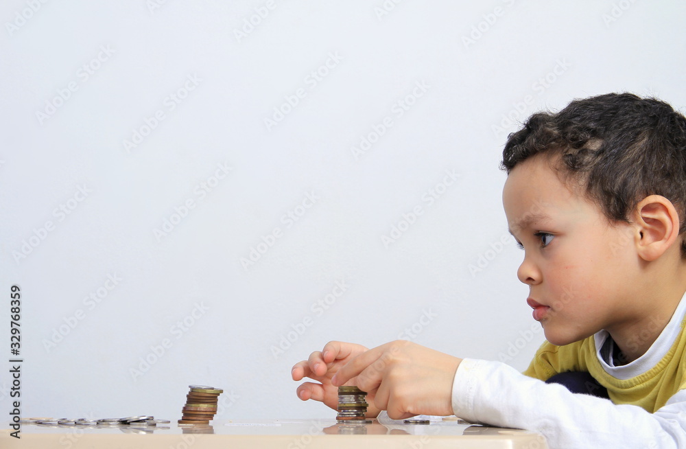child saving money with white background stock photo child saving money with white background stock photo