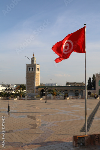 Tunisian flags flying in the wind on the Kasbah square in Tunis