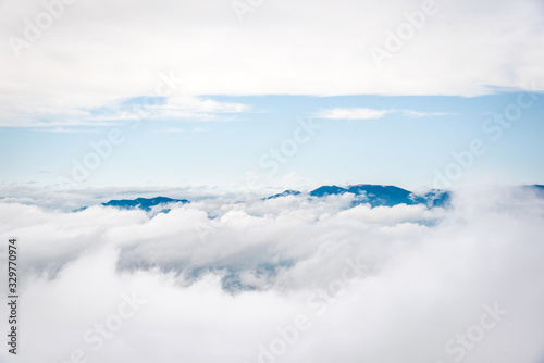 Mountain peaks covered in fog and clouds