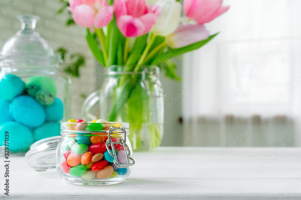 Fresh spring flowers with painted eggs for Easter celebration