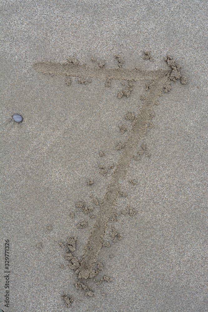 written number on sand