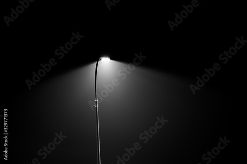 Spotlight on black background photo