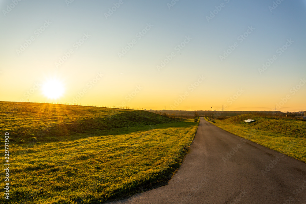 spring season shinning sunrise on a raod pathway beauty of the nature