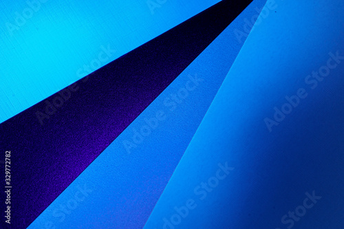Blank carton paper sheets background in dark blue light, copy space