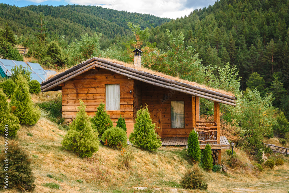 Small alpine style house in the forest. Small alpine style house in the forest.