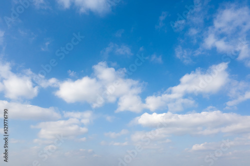 Fototapeta Naklejka Na Ścianę i Meble -  Fluffy white clouds on blue sky background.