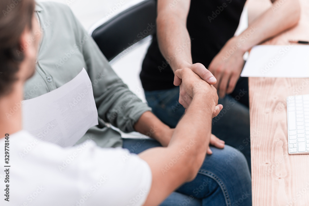 close up. welcome handshake business people in the office close up. welcome handshake business people in the office