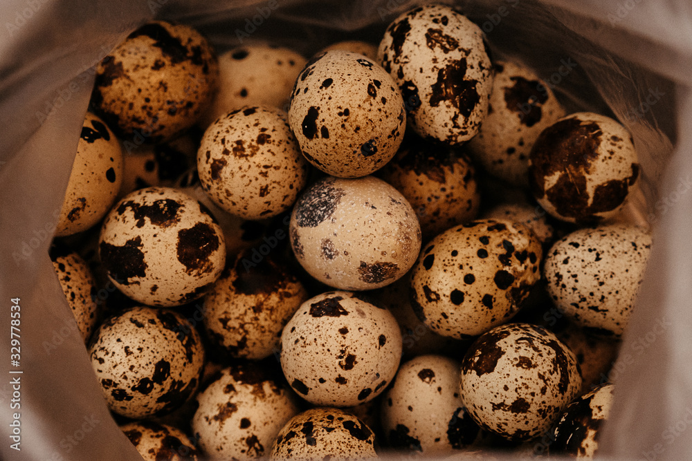 many quail eggs, easter pattern. selective focus, film and grain photo many quail eggs, easter pattern. selective focus, film and grain photo