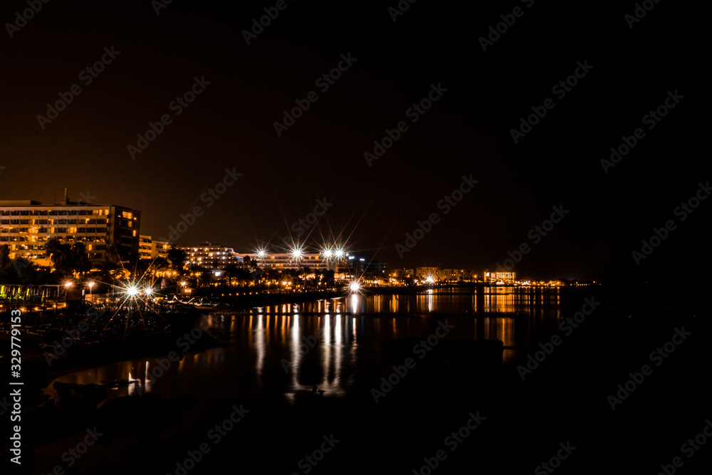 long exposure city scape with reflection in the sea