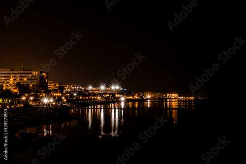 long exposure city scape with reflection in the sea