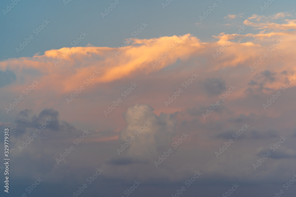 evening sky with clouds lighted with sofl light