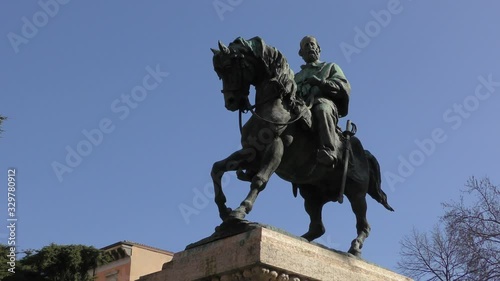 Verona, Italy. Monument to Giuseppe Garibaldi against the blue sky. Bright sunny winter day. Zoom out.	