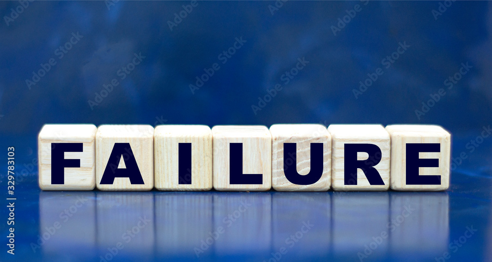 Fototapeta premium concept word failure on cubes on a blue background