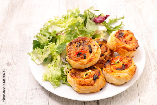 puff pastry roll with olive and tomato sauce-appetizer, finger food, snack