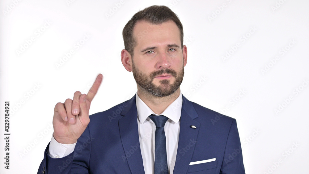 Portrait of Young Businessman saying No with Finger Sign, White Background Portrait of Young Businessman saying No with Finger Sign, White Background