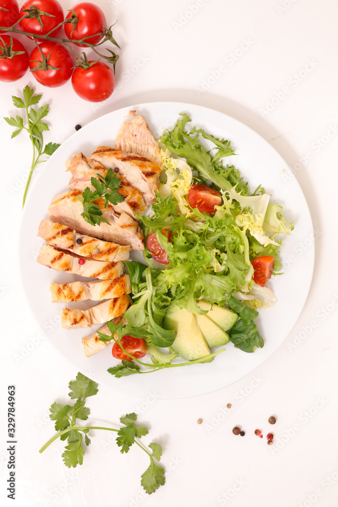 fried chicken fillet with vegetable salad in plate fried chicken fillet with vegetable salad in plate