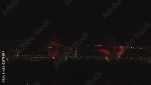 shining fireworks lights in night sky. glowing fireworks show. New year's eve fireworks celebration. multico lored fireworks in night sky. beautiful colored night explosions in black sky photo