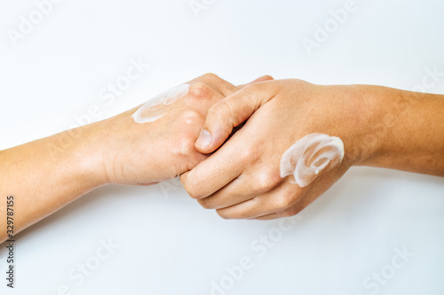Skin care concept with soft cream for sensuality woman hands. Close up woman hands isolated on white background.