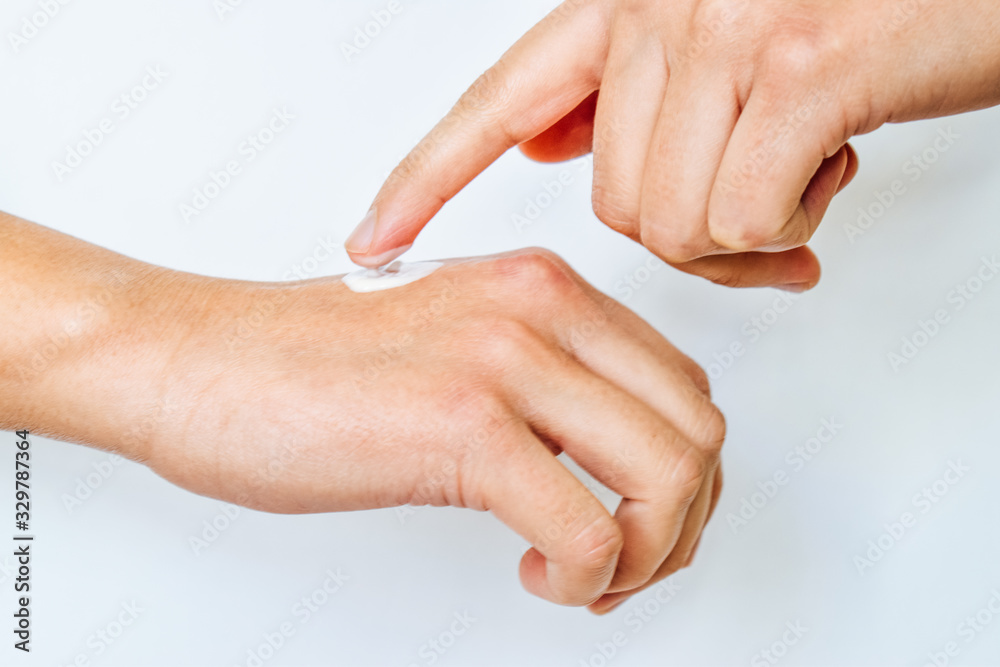 Skin care concept with soft cream for sensuality woman hands. Close up woman hands isolated on white background. Skin care concept with soft cream for sensuality woman hands. Close up woman hands isolated on white background.