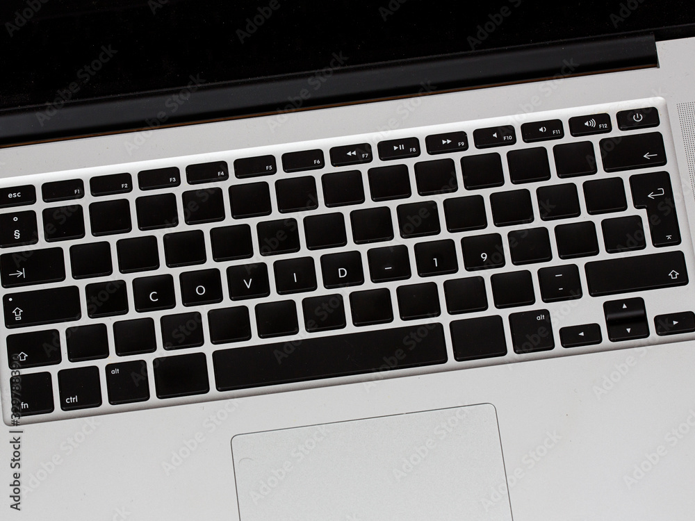 Covid and Covid-19 virus text on laptop. Dangerous disease is spreading around the world. Covid and Covid-19 virus text on laptop. Dangerous disease is spreading around the world.