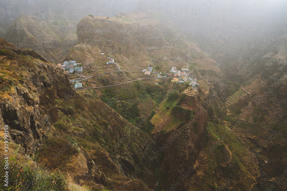 Fontaihas village. Settlement in the rocky coast of Santo Antao island. Houses nestle into the bluff ridge wall Fontaihas village. Settlement in the rocky coast of Santo Antao island. Houses nestle into the bluff ridge wall