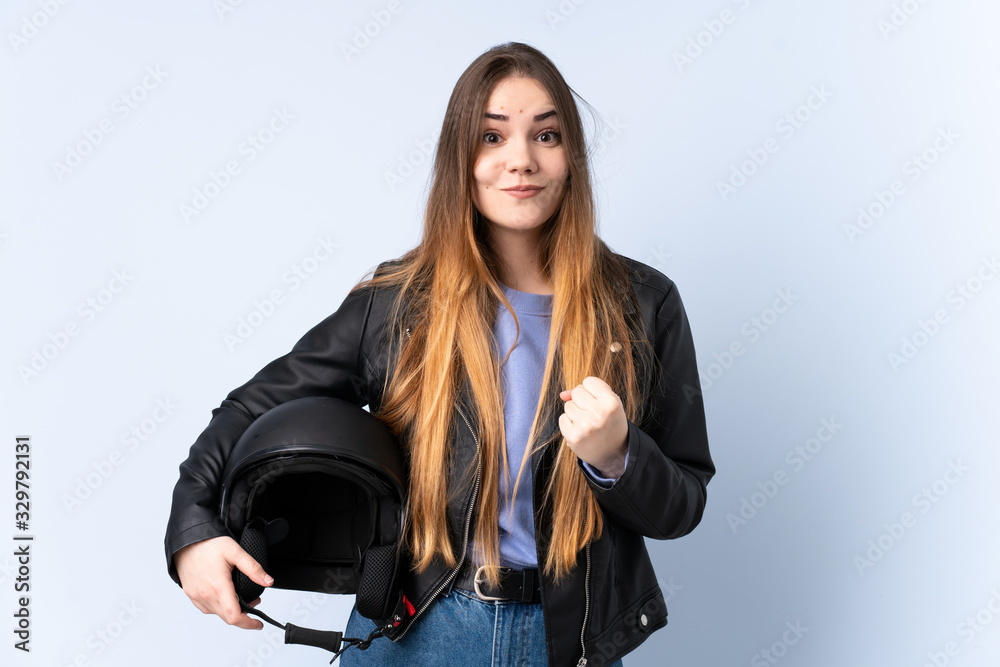 Woman with a motorcycle helmet celebrating a victory Woman with a motorcycle helmet celebrating a victory