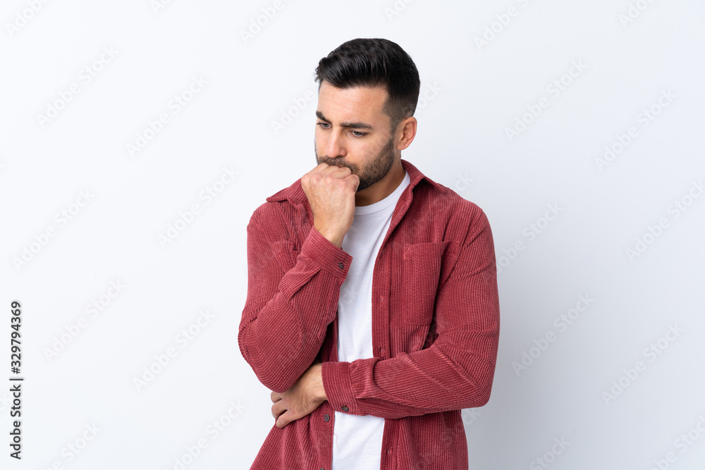 Young handsome man with beard wearing a corduroy jacket over isolated white background having doubts Young handsome man with beard wearing a corduroy jacket over isolated white background having doubts