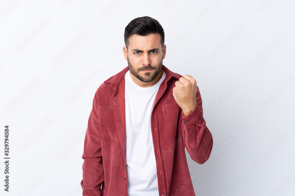 Young handsome man with beard wearing a corduroy jacket over isolated white background with angry gesture Young handsome man with beard wearing a corduroy jacket over isolated white background with angry gesture