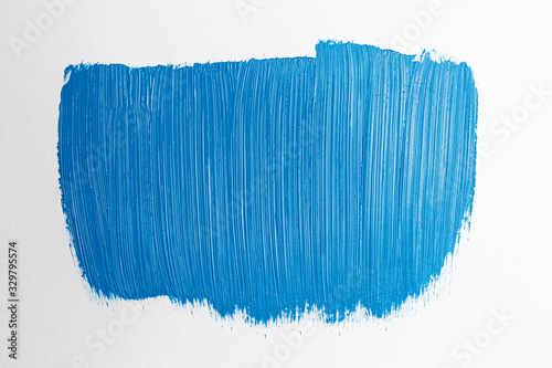Abstract texture of classic blue paint on paper. Brush and paint texture. White background. Brush stroke. Art concept