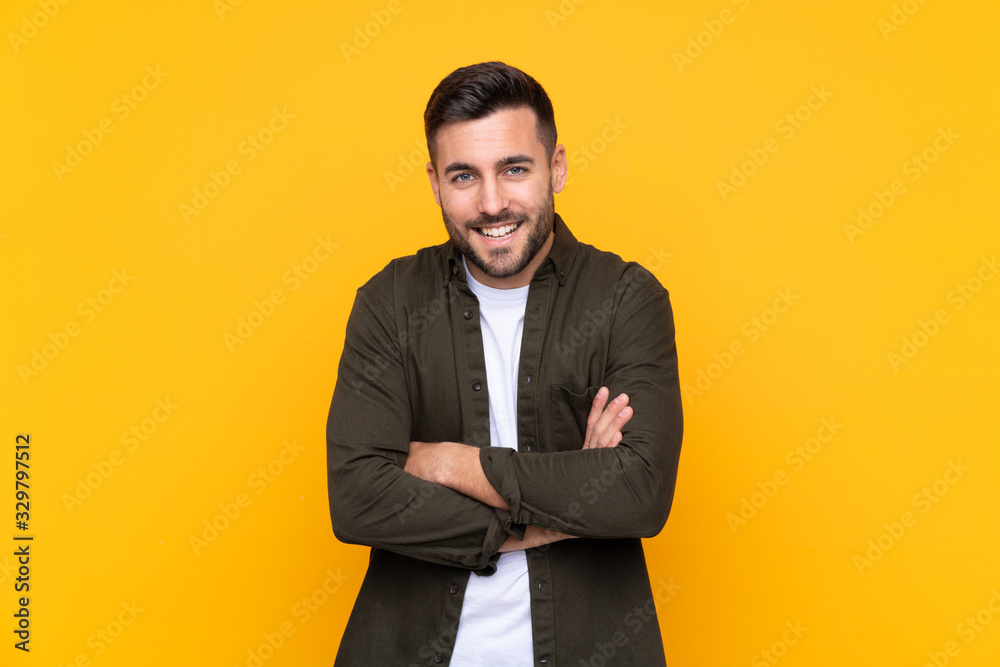 Man over isolated yellow background laughing Man over isolated yellow background laughing