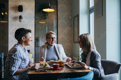 women friends having lunch break in restaurant 